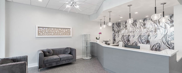 front desk area of Rosewood Dental, decorated in white and grey