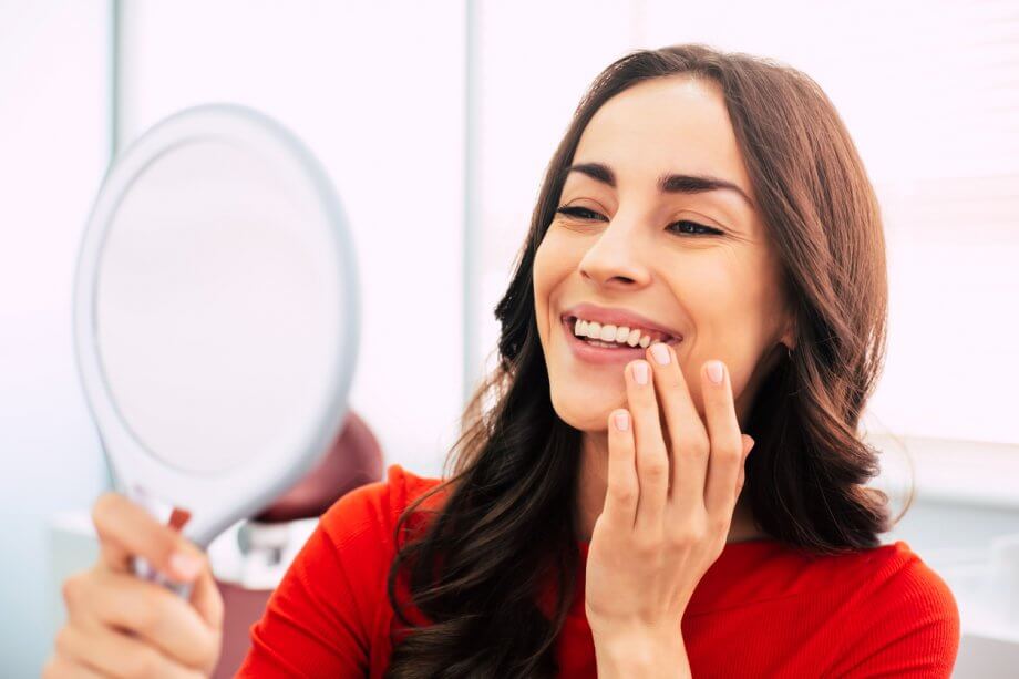 woman looking at teeth