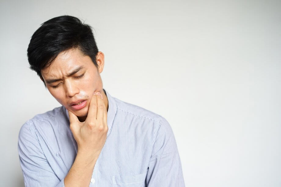 man having tooth pain