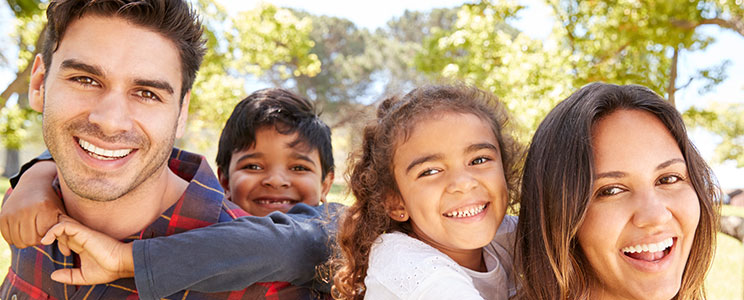 smiling family of four